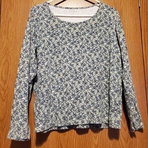 Long sleeve sage green shirt with blue flowers.